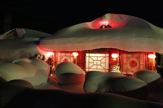 A snow covered house looks like a huge white crab