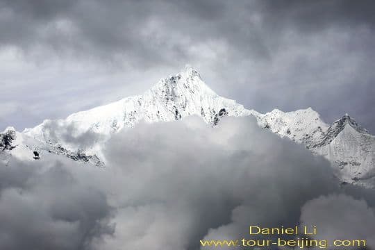 Clouds are closing in on Kawagebo Peak