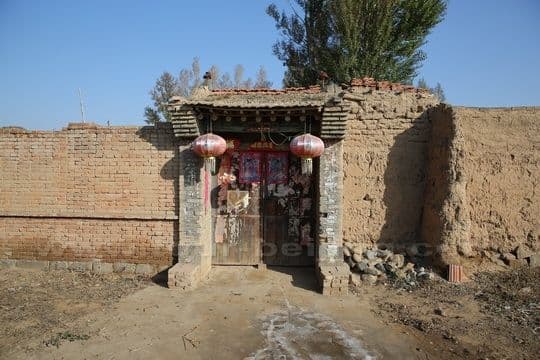 The door frame at one of the houses by the only one street village