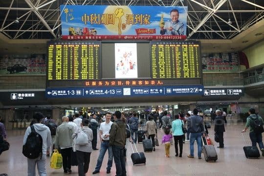 you will see a huge electronic train schedule board