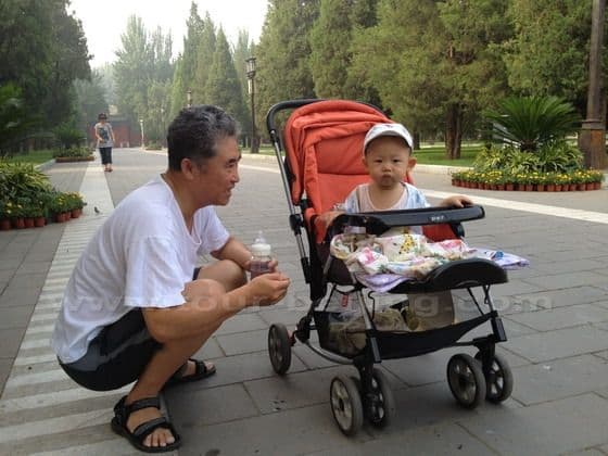 happen to take a candid photo of a cute baby escorted by his grandpa.