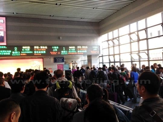 people are lining up to have their tickets checked