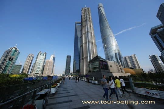 Walking past the three tallest buildings.