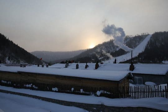 we find part of the village is bathing under the sunrise glow